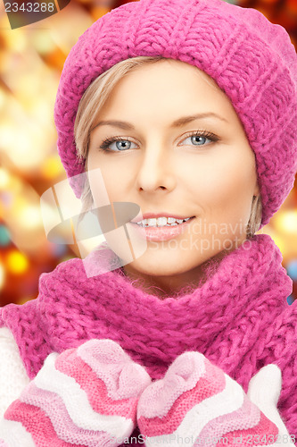 Image of beautiful woman in hat, muffler and mittens