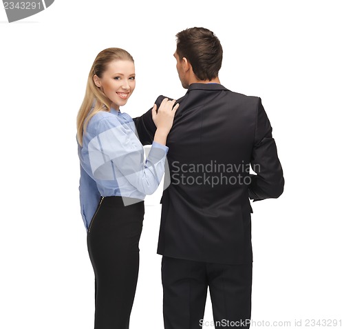 Image of man and woman working with something imaginary