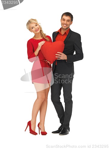 Image of beautiful couple holding big heart