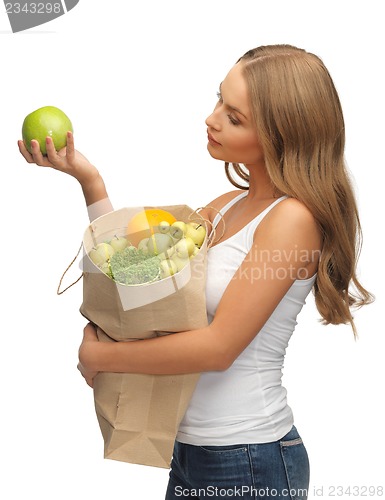 Image of woman with shopping bag full of fruits