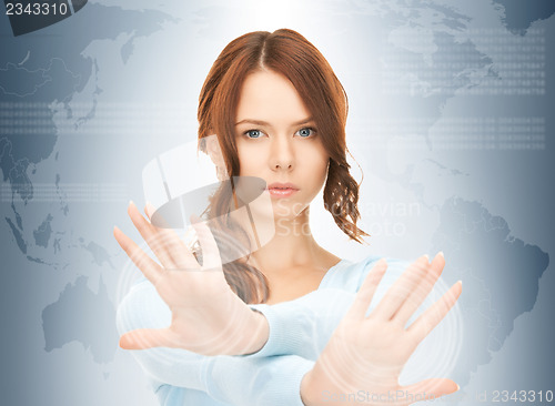 Image of businesswoman working with touch screen