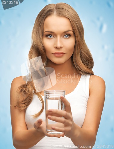 Image of woman hands holding glass of water