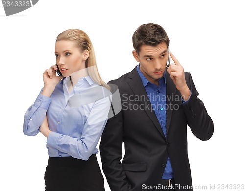Image of man and woman with cell phones