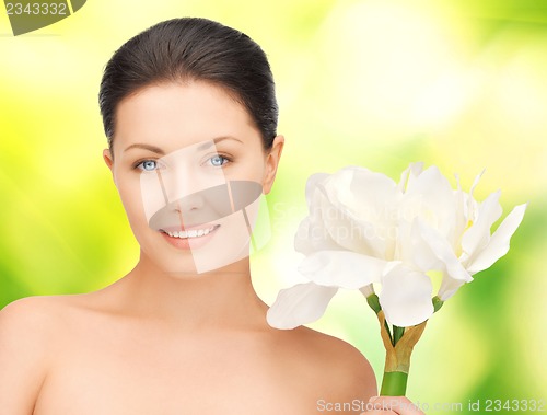 Image of lovely woman with lily flower