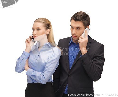 Image of man and woman with cell phones