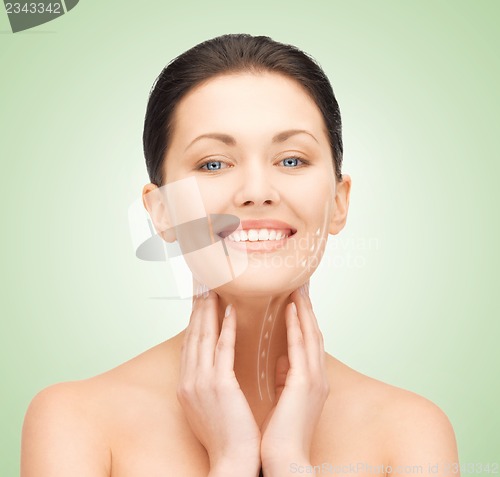 Image of face and hands of beautiful woman