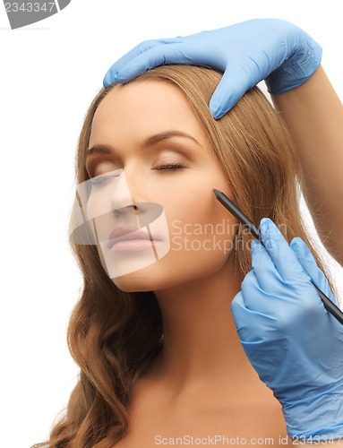 Image of woman face and beautician hands