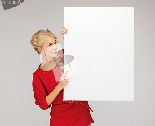 Image of lovely woman in red dress with blank board