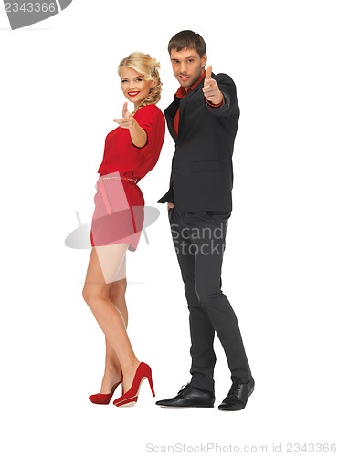 Image of man and woman making a gun gesture