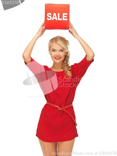 Image of lovely woman in red dress with sale sign