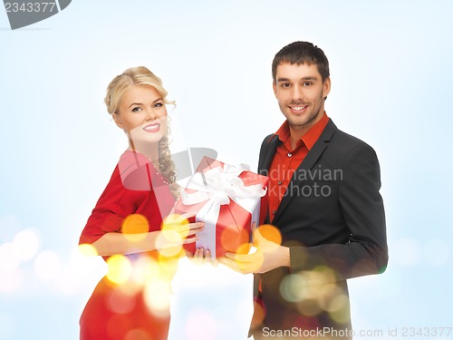 Image of man and woman with present