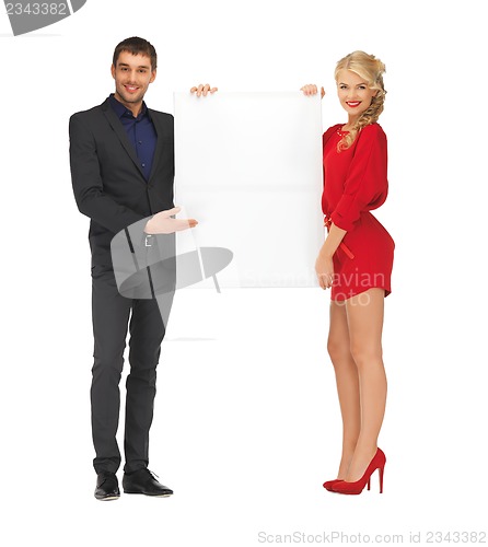Image of couple holding big blank board