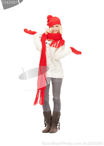 Image of beautiful woman in hat, muffler and mittens