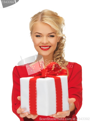 Image of lovely woman in red dress with present