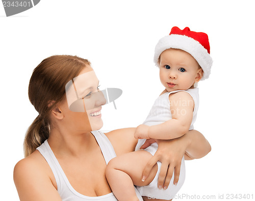 Image of mother with baby in santa helper hat