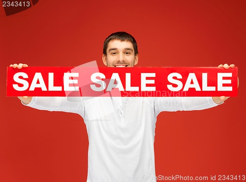 Image of handsome man with sale sign