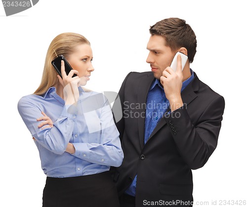 Image of man and woman with cell phones