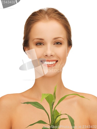 Image of woman with green sprout