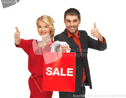 Image of man and woman with shopping bag