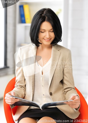 Image of businesswoman with magazine