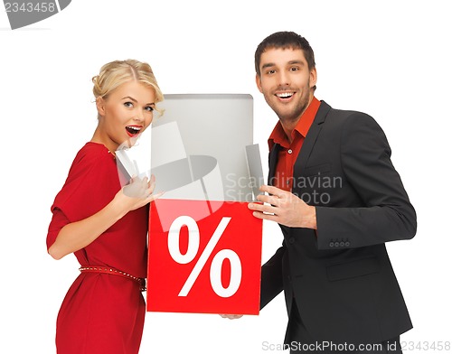 Image of man and woman with percent sign