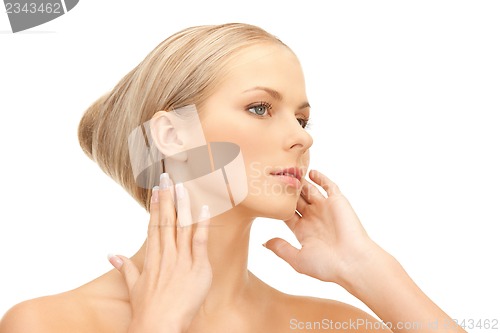 Image of face and hands of beautiful woman