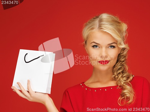 Image of lovely woman in red dress with shopping bag
