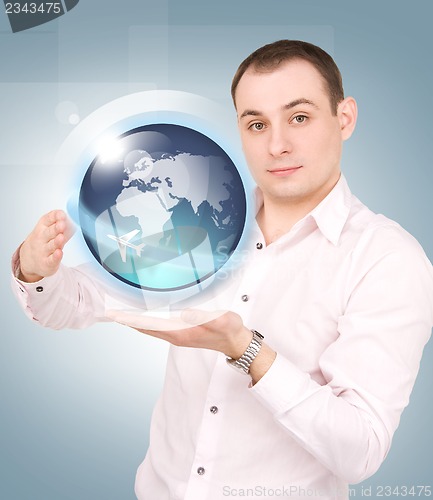 Image of earth globe on the palms of his hands