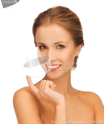 Image of beautiful woman with moisturizing creme drop