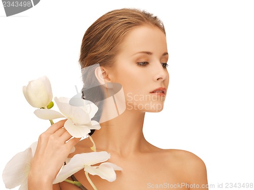 Image of lovely woman with orchid flower