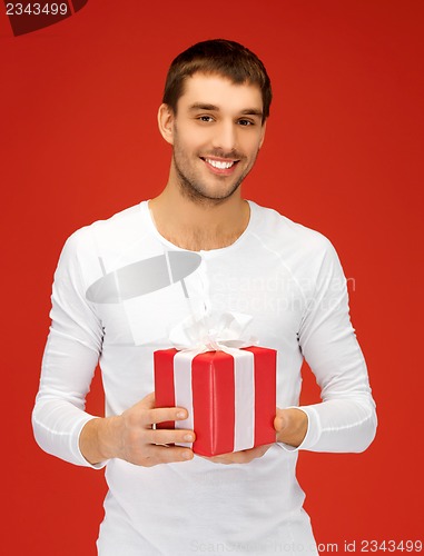 Image of handsome man with a gift