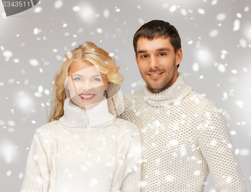 Image of family couple in a sweaters