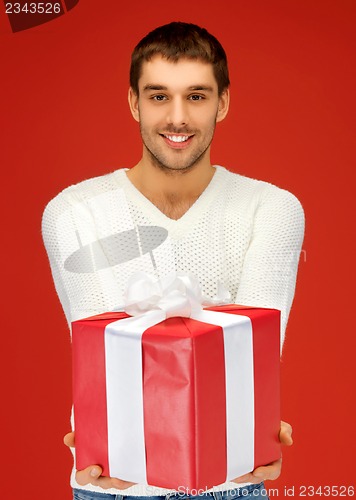 Image of handsome man with a gift