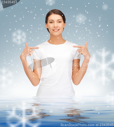 Image of happy and carefree teenage girl in water
