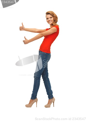 Image of teenage girl in red t-shirt showing thumbs up