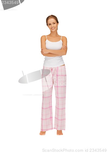 Image of happy and smiling woman in cotton pajamas