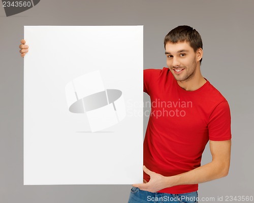 Image of handsome man with big blank board