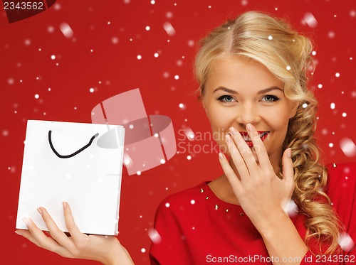 Image of lovely woman in red dress with shopping bag