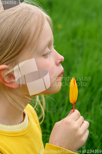 Image of Licking yellow ice-cream