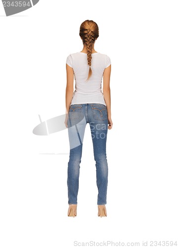 Image of rear view of woman in blank white t-shirt