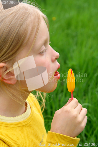 Image of Licking yellow ice-cream