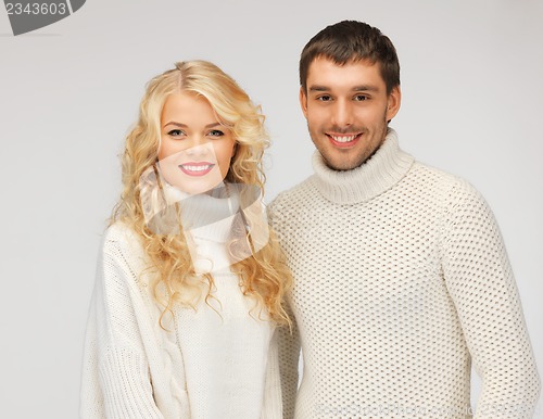 Image of family couple in a sweaters