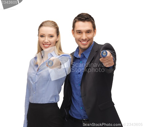 Image of man and woman with flashlights