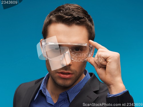 Image of businessman in protective glasses