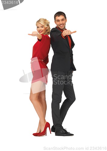 Image of man and woman showing thumbs up, down