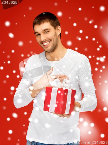 Image of handsome man with a gift