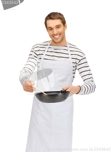 Image of handsome man with pan and spoon