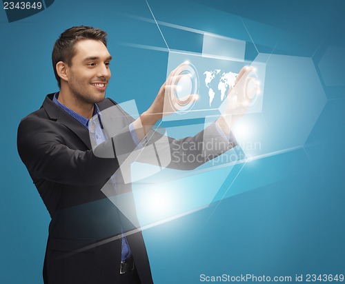 Image of man in suit working with virtual screens