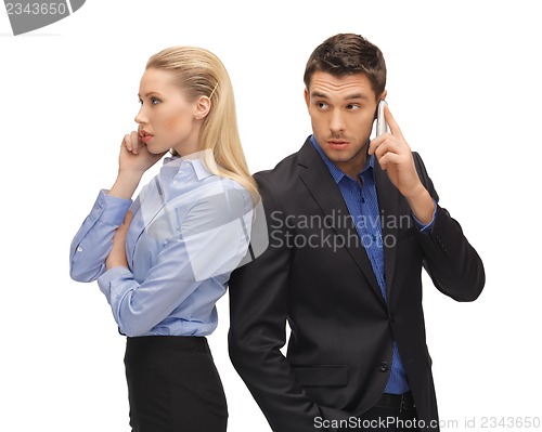 Image of man and woman with cell phones