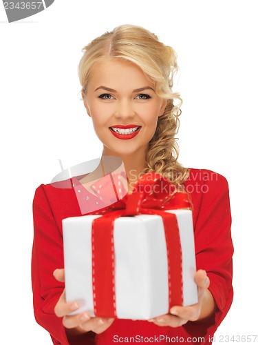 Image of lovely woman in red dress with present